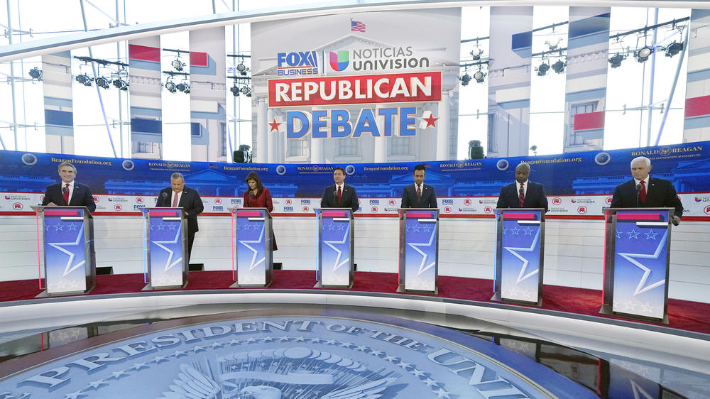 Republican presidential candidates, from left, North Dakota Gov. Doug Burgum, former New Jersey Gov. Chris Christie, former U.N. Ambassador Nikki Haley, Florida Gov. Ron DeSantis, entrepreneur Vivek Ramaswamy, Sen. Tim Scott, R-S.C. and former Vice President Mike Pence, stand at their podiums during a Republican presidential primary debate hosted by FOX Business Network and Univision on Wednesday.