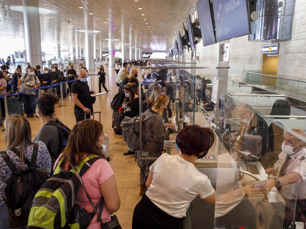 Passengers at the check-in desks in the departures hall at Ben Gurion International airport in Tel Aviv, Israel, on Nov. 30, 2021.