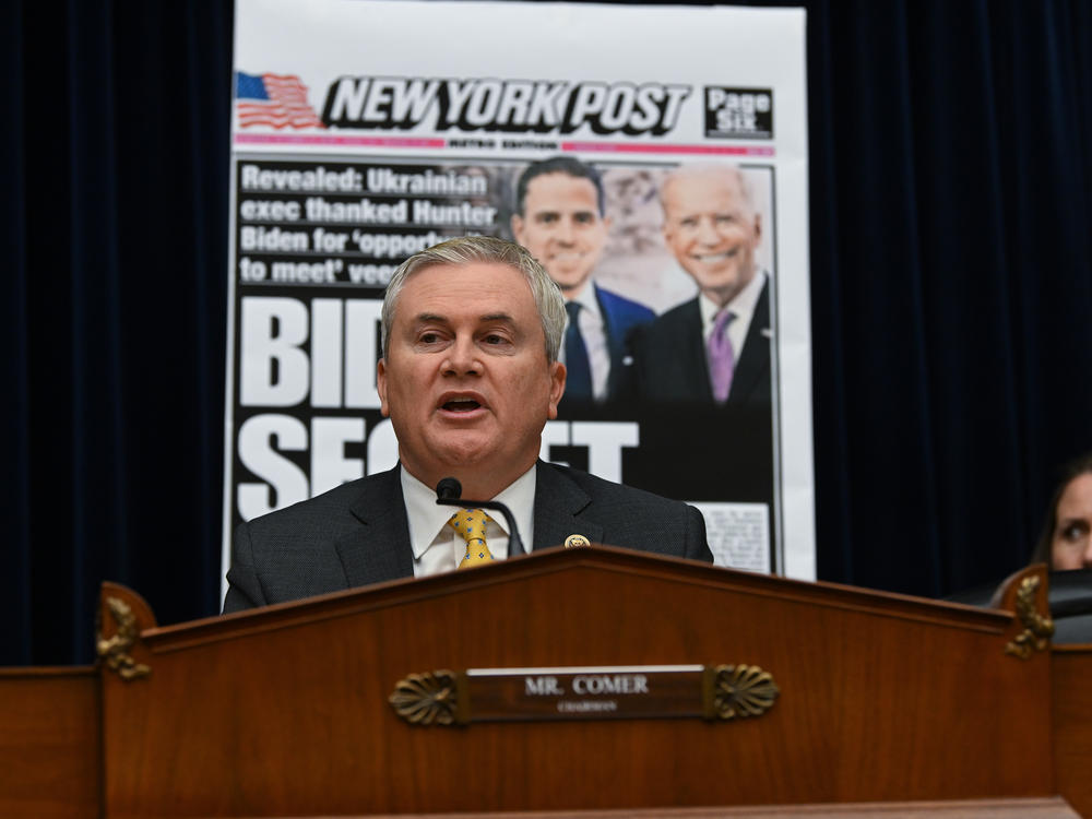 House Oversight Committee Chairman Rep. James Comer is seen in front of a newspaper page with a photograph of Hunter Biden and his father President Biden during a House Committee on Oversight and Accountability hearing on Feb. 8.