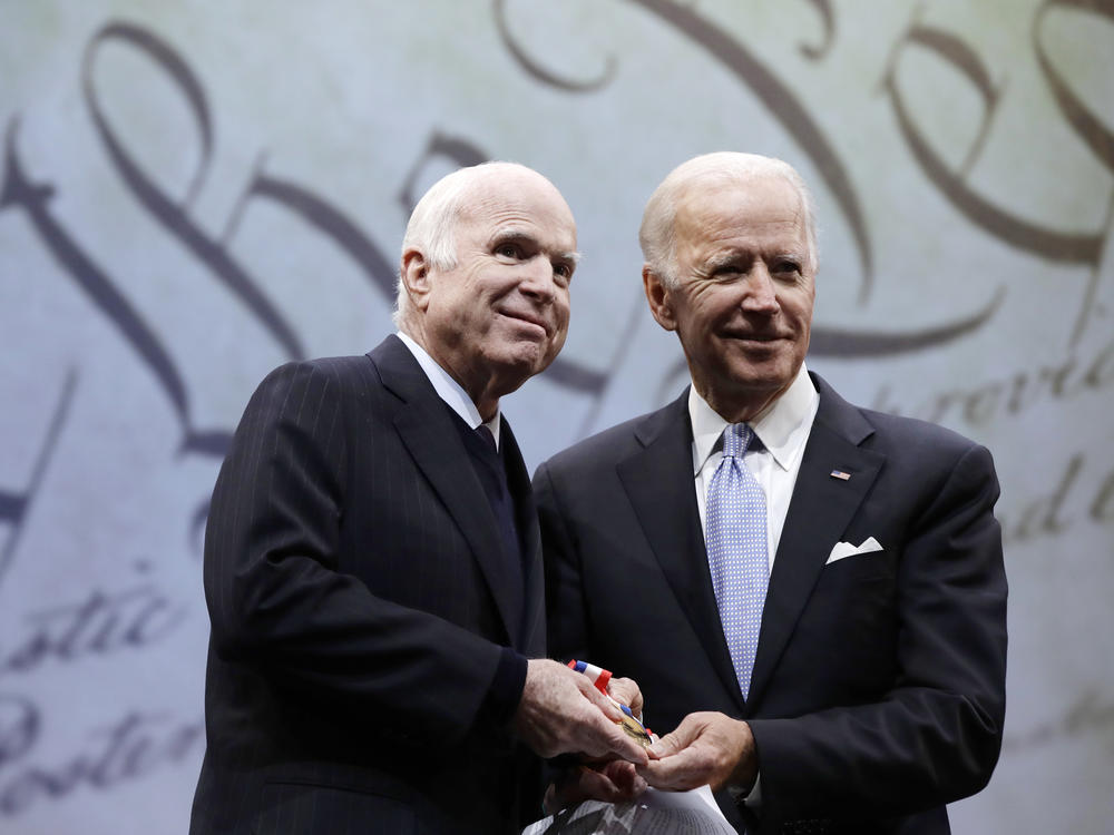 Republican Sen. John McCain and now-President Biden in Philadelphia on Oct. 16, 2017.