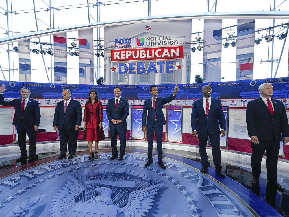 Republican presidential candidates, from left, North Dakota Gov. Doug Burgum, former New Jersey Gov. Chris Christie, former U.N. Ambassador Nikki Haley, Florida Gov. Ron DeSantis, entrepreneur Vivek Ramaswamy, Sen. Tim Scott, R-S.C., and former Vice President Mike Pence, at a debate hosted by FOX Business and Univision, Wednesday at the Ronald Reagan Presidential Library in Simi Valley, Calif.