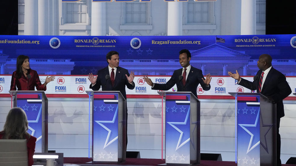 From left to right, former U.N. Ambassador Nikki Haley, Florida Gov. Ron DeSantis, businessman Vivek Ramaswamy and Sen. Tim Scott, R-S.C., argue a point during a Republican presidential primary debate at the Ronald Reagan Presidential Library in Simi Valley, Calif., on Wednesday.