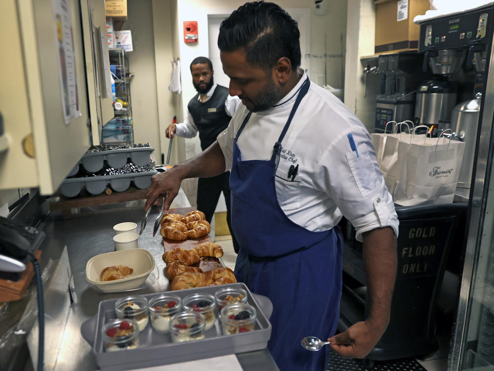 Chef Zaid Khan prepares food in Boston to be sold through the app Too Good To Go. The app helps establishments sell food that would otherwise go to waste.