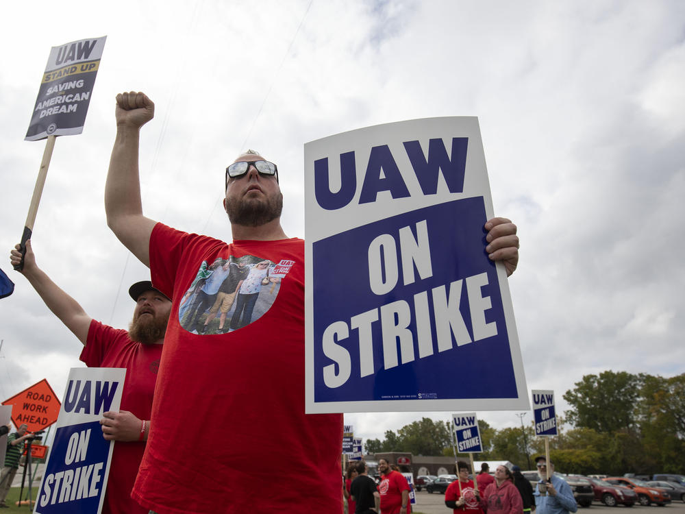 UAW members strike at GM's Lansing-Delta Assembly Plant in Lansing, Mich., on Sept. 29, 2023. The UAW on Friday expanded its strike against GM and Ford, but not Stellantis.