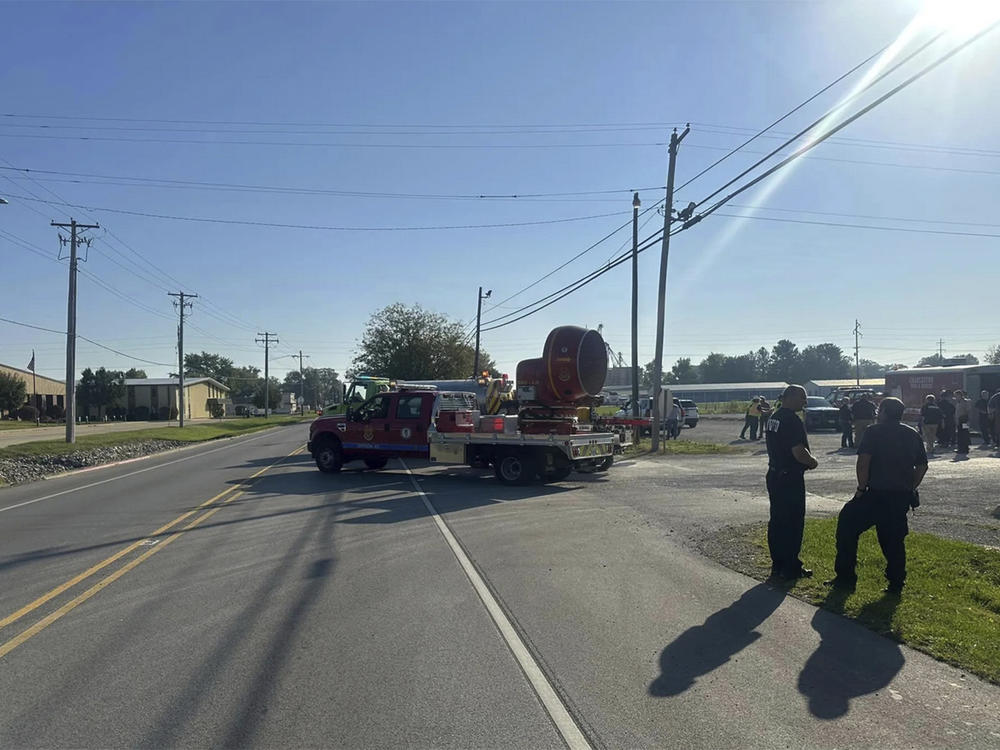Emergency responders work the scene of semitruck crash in Teutopolis, Ill., on Saturday. Federal regulators confirmed they are reviewing the crash of a semitruck carrying a toxic substance in central Illinois, resulting in 