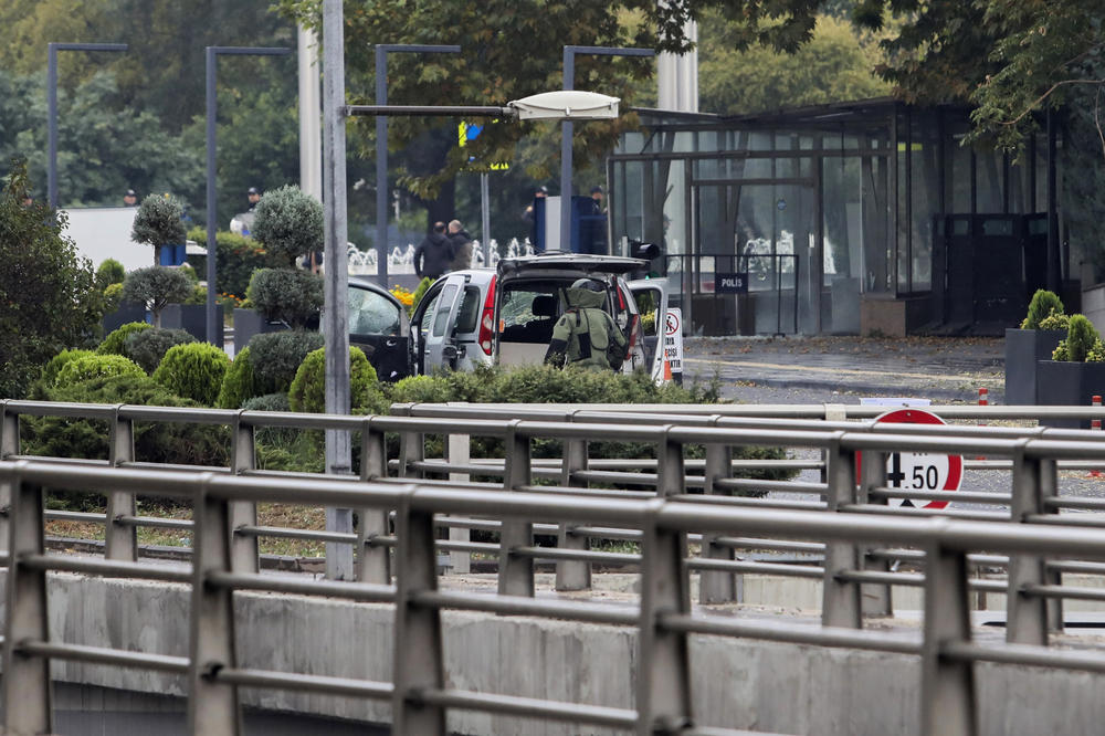 Turkish policemen and security forces cordon off an area next to a car after an explosion in Ankara on Sunday.