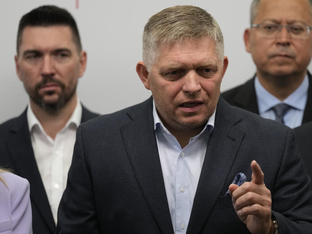 Chairman of Smer party Robert Fico (center) addresses reporters in Bratislava, Slovakia, on Sunday.