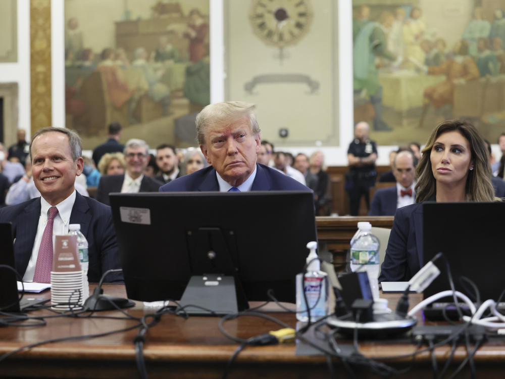 Former President Donald Trump (center) appears in court Monday in New York.