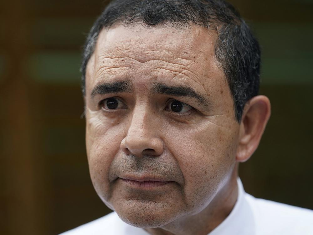 U.S. Rep. Henry Cuellar, D-Texas, is shown talking to a member of the media during a campaign event in San Antonio, May 4, 2022.