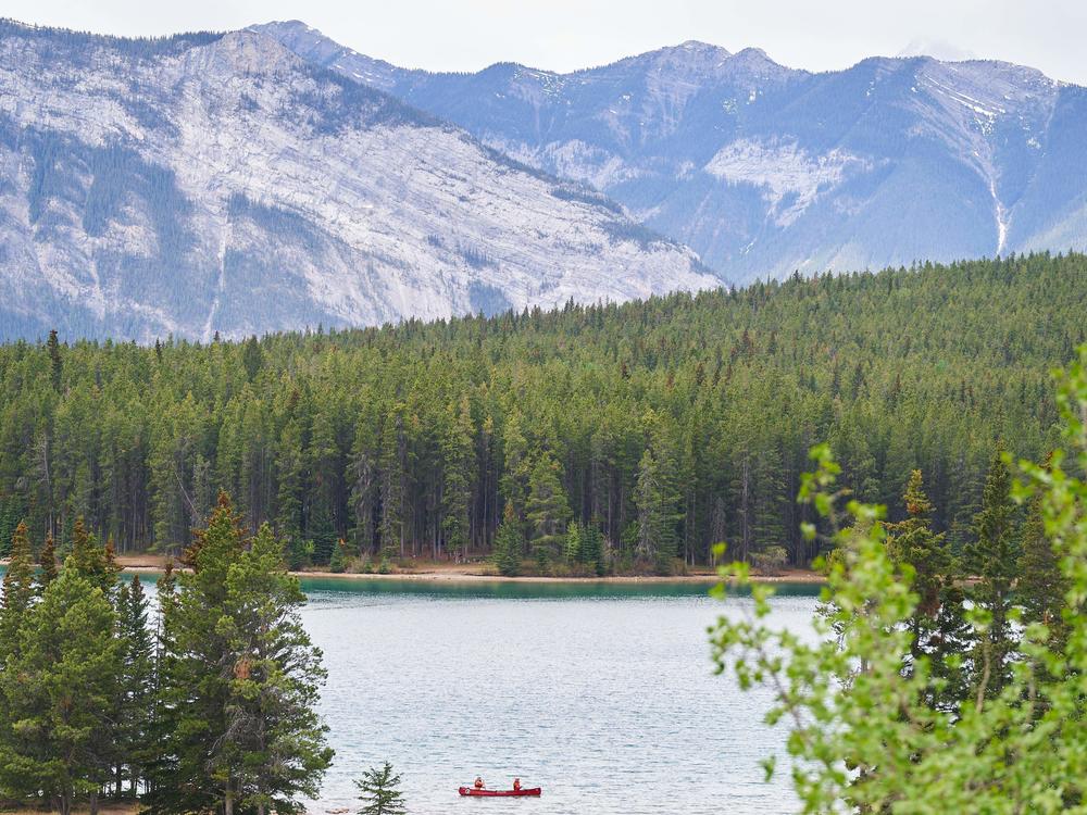 Visitors canoe on Lake Minnewanka in Banff National Park in Banff, Alberta, Canada, on May 23, 2023.