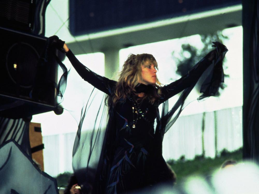 Nicks — in her signature black outfit and flowing sleeves — performs with Fleetwood Mac in May 1977.
