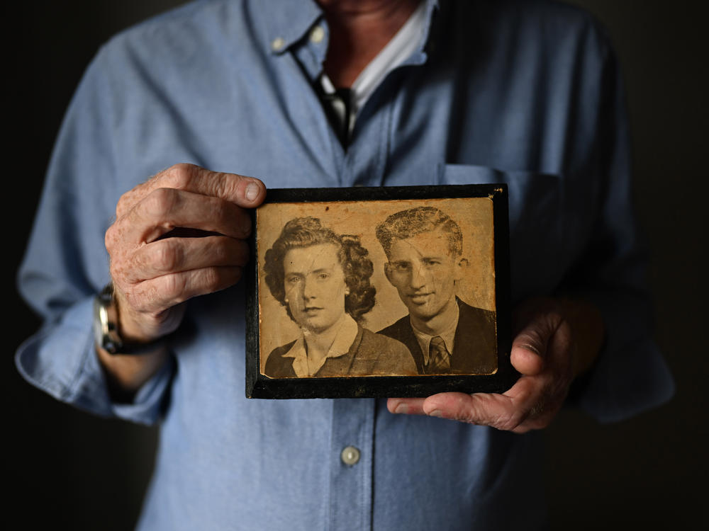 Paul Crawford holds a photograph of his mother and father at his home in Glenavy. His father John Crawford was shot dead in 1974 in front of the West Belfast furniture factory he ran.