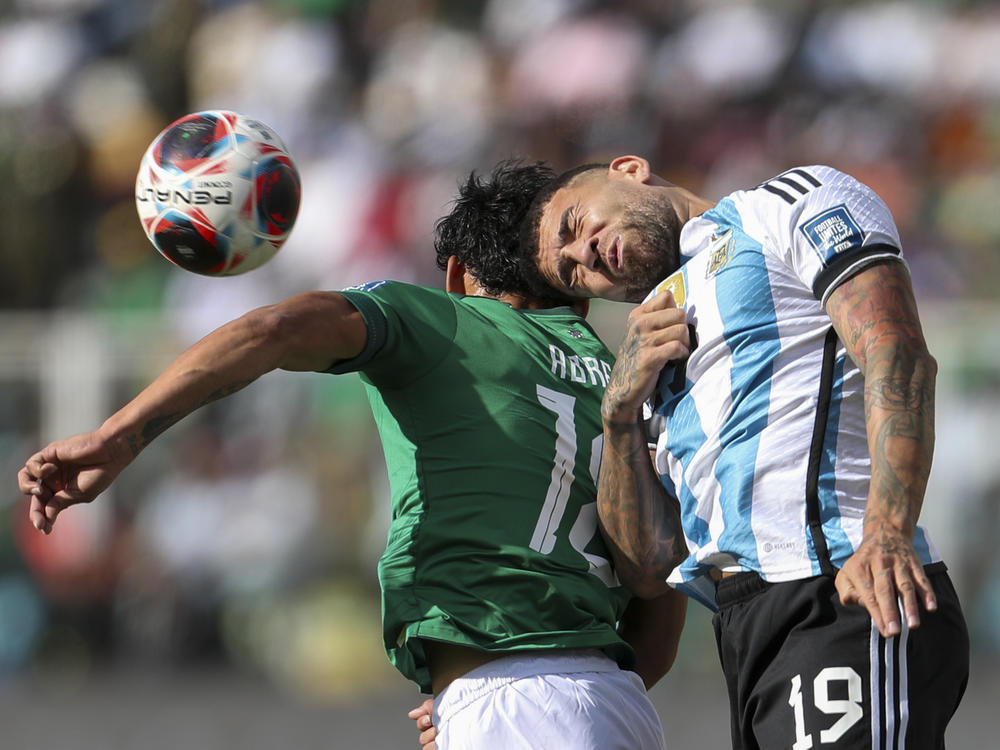 Argentina's Nicolás Otamendi goes for a header with Bolivia's Victor Ábrego during a qualifying match for the FIFA World Cup 2026 at Hernando Siles stadium in La Paz, Bolivia, on Sept. 12.