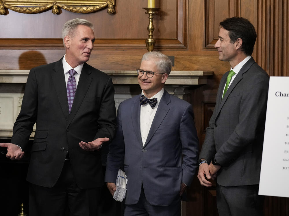 Then-Speaker of the House Kevin McCarthy talks with Rep. Patrick McHenry and Rep. Garret Graves on May 31, 2023.