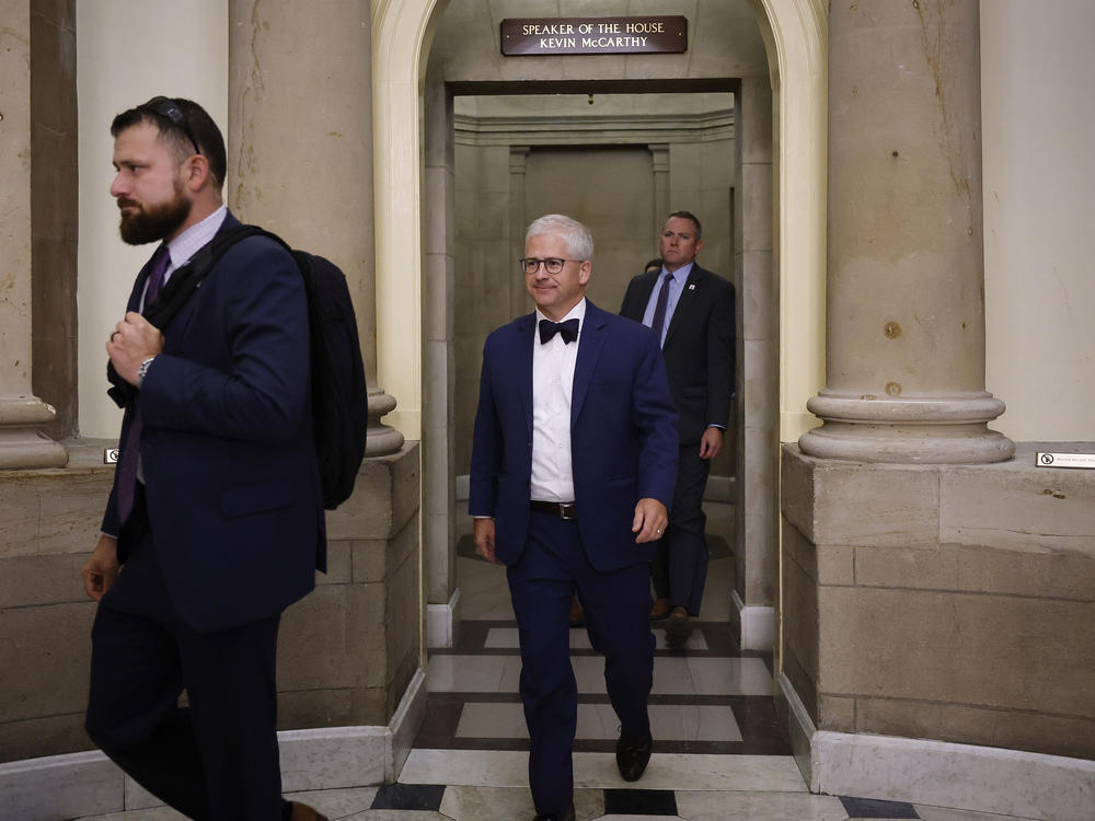 House speaker pro tempore Patrick McHenry (center) walks out of the offices of former Speaker of the House Kevin McCarthy on Wednesday. The process is underway to replace McCarthy after he was ousted from the speakership on Tuesday.