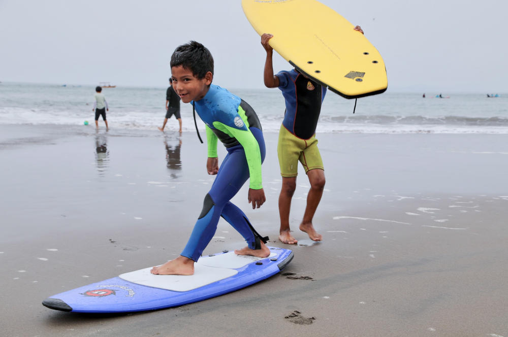 Boran Bumovich Hignio, age 7, practices his surfing stance.