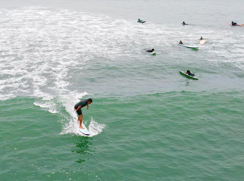 Alto Peru students surfing. 