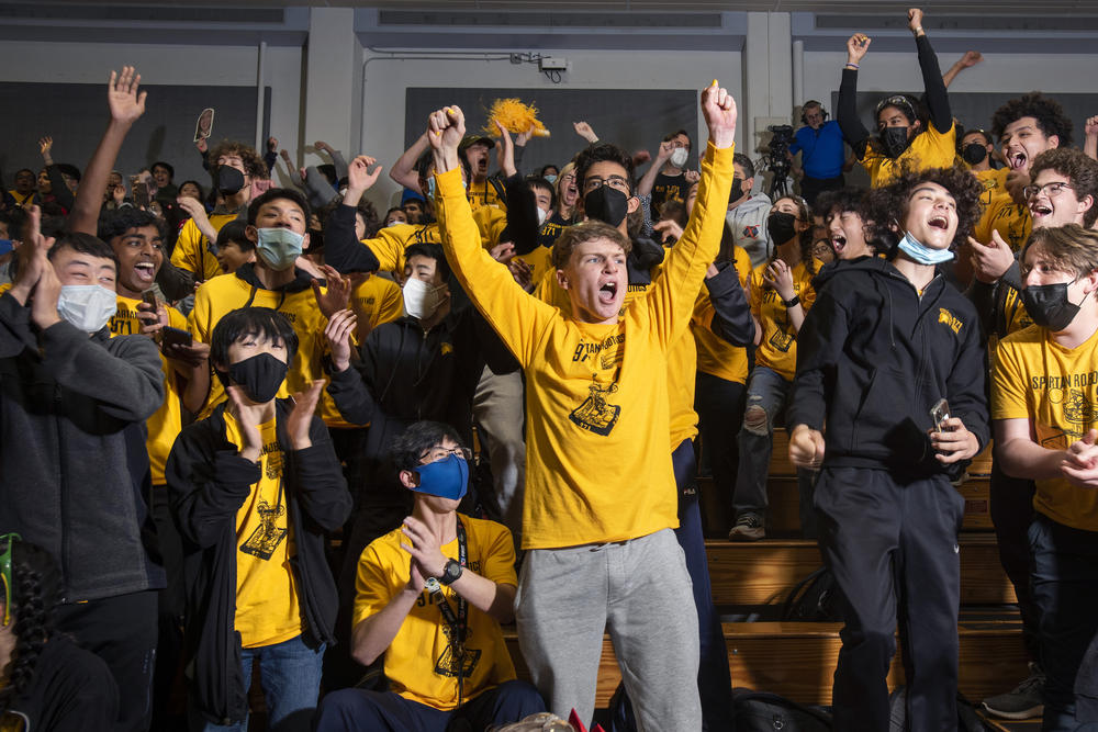 Lara Fernando (upper right corner, black sleeves extended upward) and Spartan Robotics explode the moment they know they have won the 2023 San Francisco Regional and qualified for Houston.