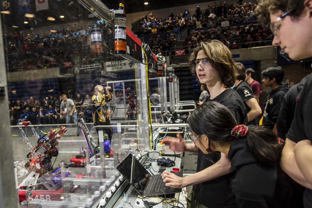 Theo Gerst, 18, checks Berkelium's targeting camera and autonomous functions before a playoff match at the 2023 Sacramento Regional.