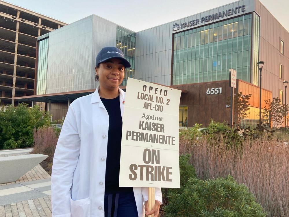 Kaiser clinical pharmacist Keyani Adigun joins her union's picket line outside the Kaiser Permanente Springfield Medical Center in Virginia, on Wednesday, Oct. 4 2023.