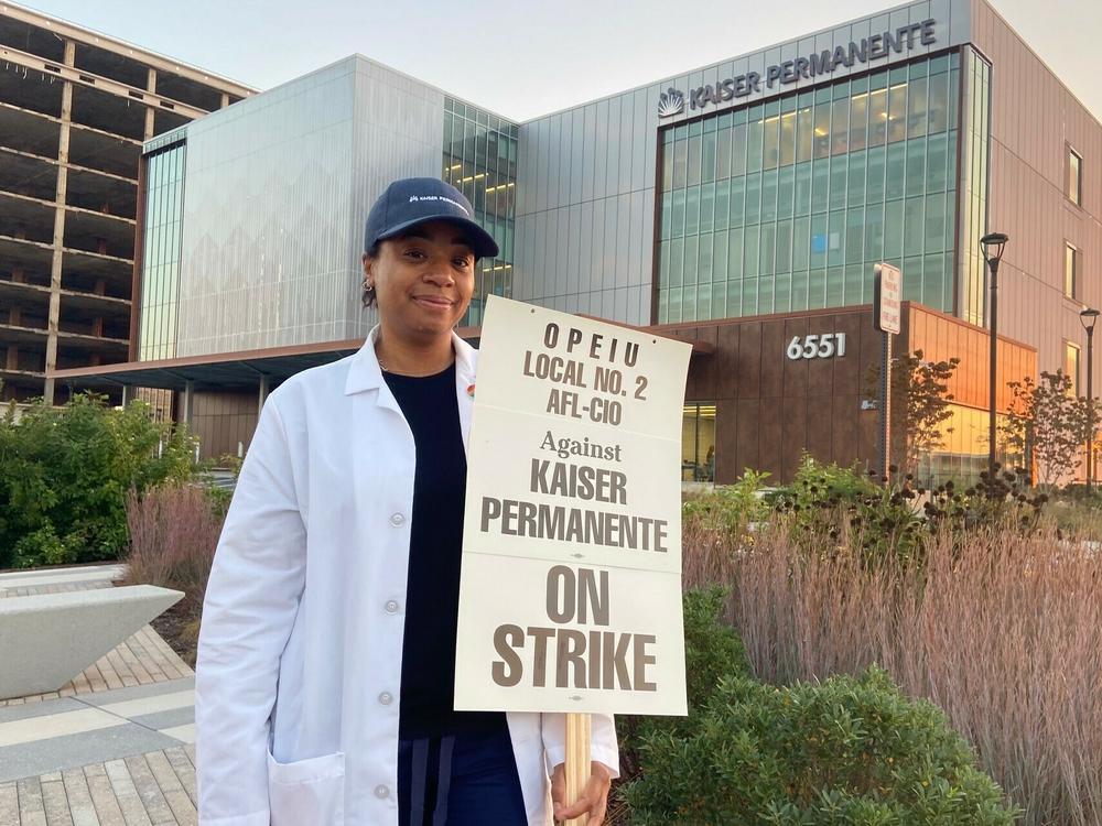 Kaiser clinical pharmacist Keyani Adigun joins her union's picket line outside the Kaiser Permanente Springfield Medical Center in Virginia, on Wednesday, Oct. 4 2023.