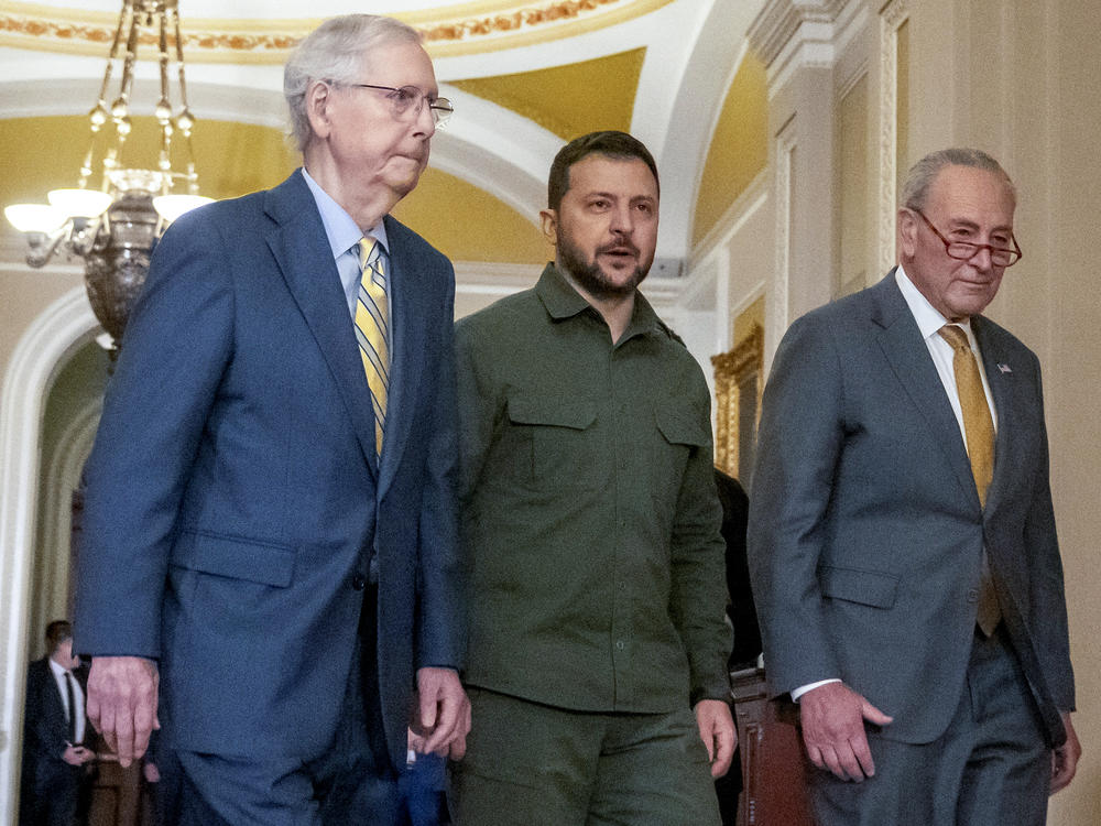 Ukrainian President Volodymyr Zelenskyy (center) walks with Senate Minority Leader Mitch McConnell, R-Ky., (left) and Senate Majority Leader Chuck Schumer, D-N.Y., on September 21. Zelenskyy made his renewed case for American aid to Ukraine to a deeply divided Congress.