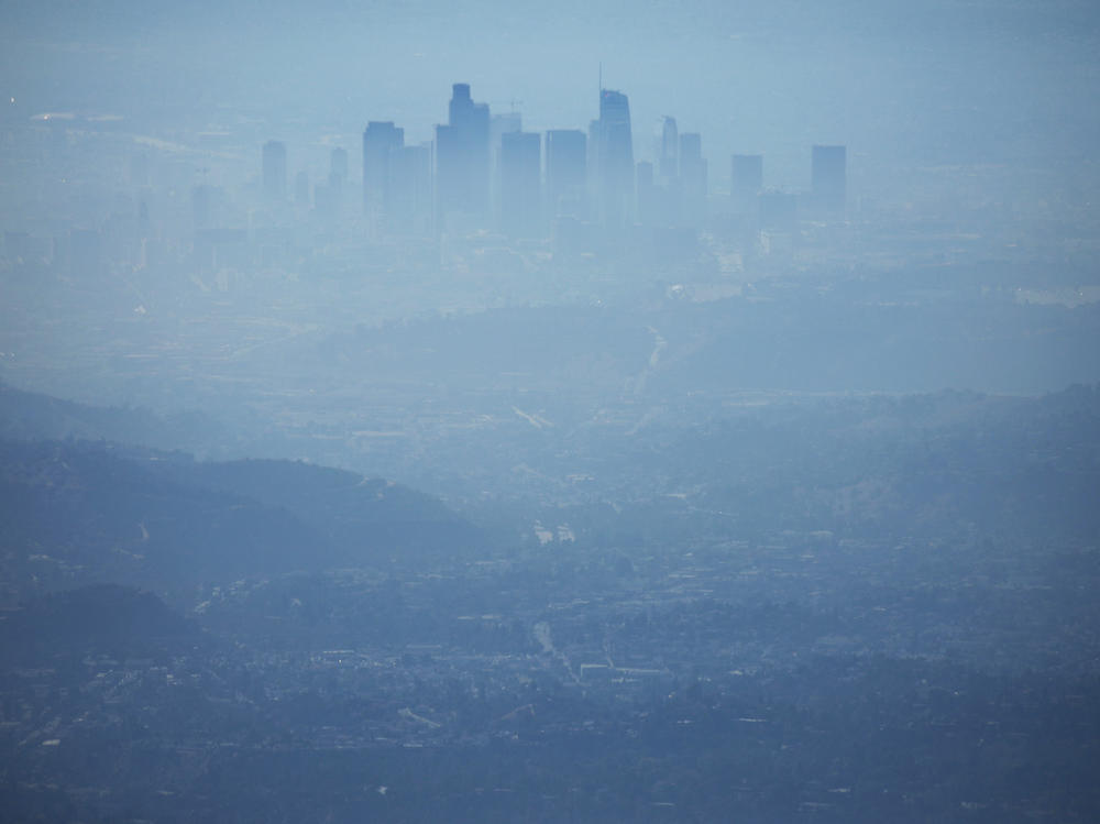 The buildings of downtown Los Angeles are partially obscured because of smog.