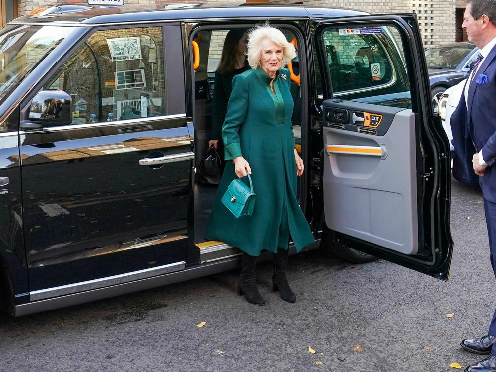 Queen Camilla steps out of a London taxi as she arrives to visit Barnardo's Nursery in November, 2022.