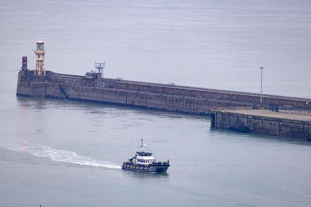 Asylum-seekers aboard a U.K. Border Force boat arrive at docks in Dover, England, after being rescued in the English Channel while crossing it in January.