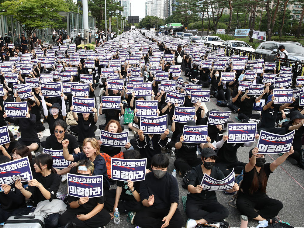 South Korean teachers participate in a rally in front of the National Assembly on Sept. 4, 2023 in Seoul, South Korea. School teachers rallied to mourn the recent suicide deaths of fellow teachers distressed by disgruntled parents and unruly students, and to call for measures to prevent such tragedies.