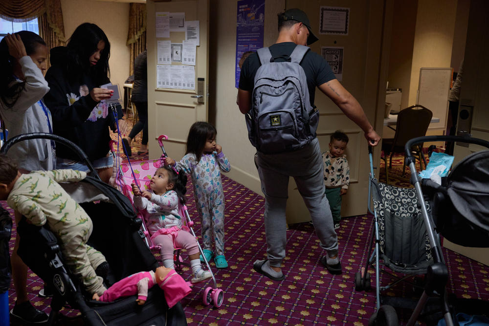 Families chat in the hallway at the<strong> Roosevelt Hotel's medical clinic.</strong>