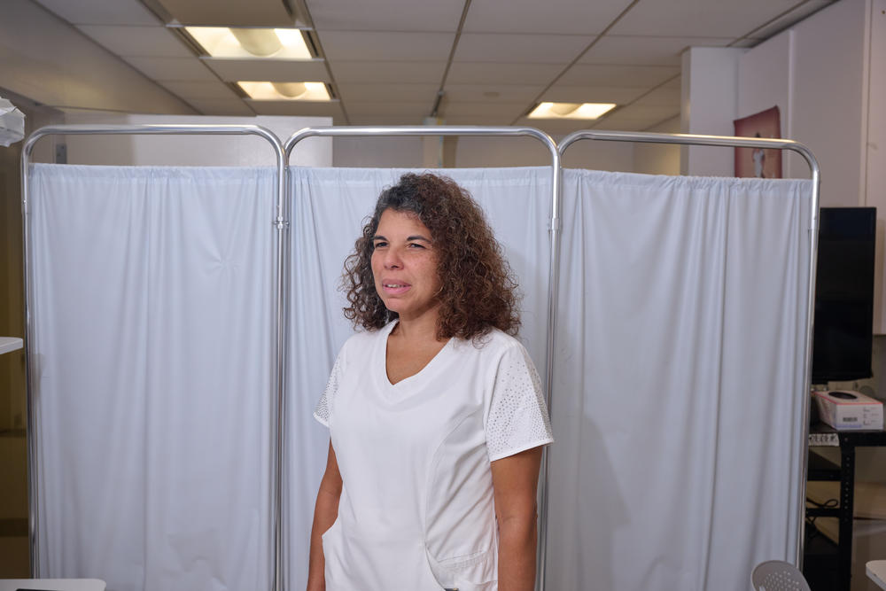 Maria Vazquez poses for a portrait in a clinical suite at Bellevue Hospital.