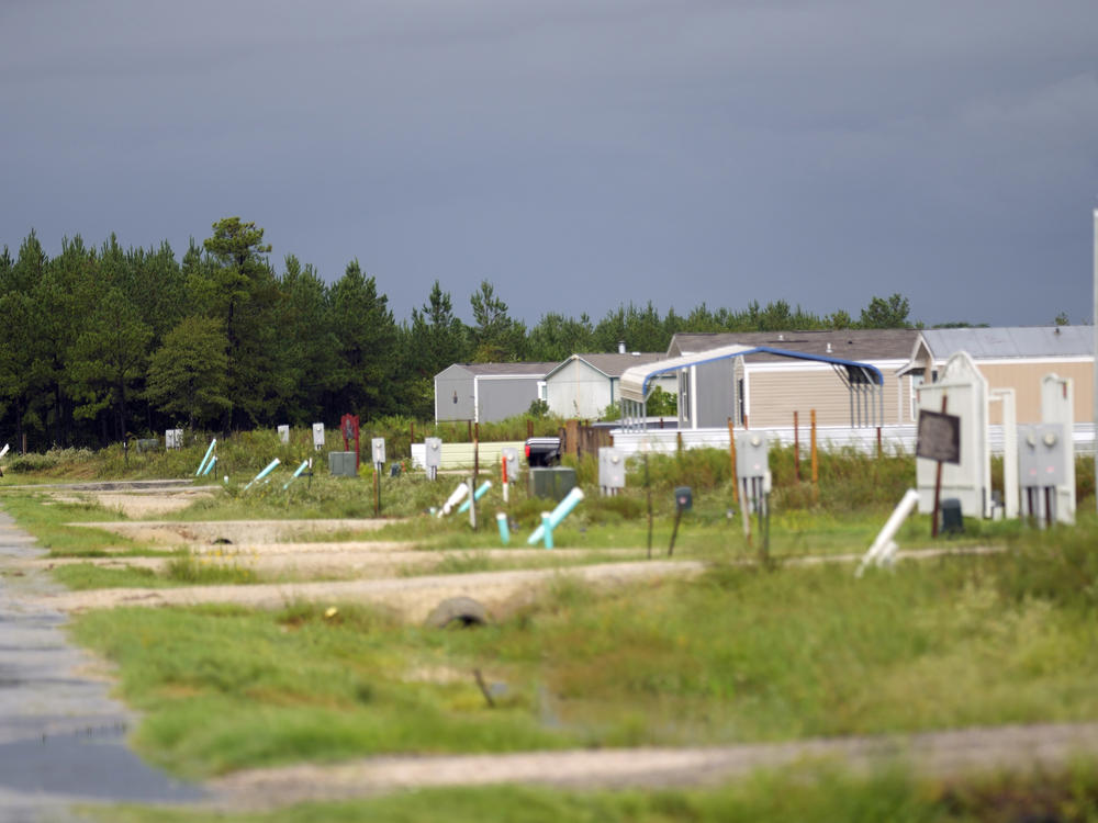 A row of mobile home is shown in the Colony Ridge development in Texas. Unsubstantiated claims that the development is attracting undocumented immigrants and drug cartel members have made it all the way to the Statehouse, where governor has called a special session to increase border enforcement.