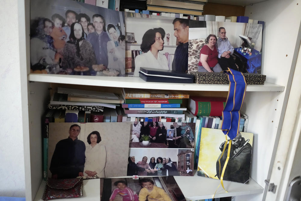 Family pictures are seen at the apartment of Narges Mohammadi's husband Taghi Rahmani Friday, Oct. 6, 2023 in Paris. Imprisoned Iranian activist Narges Mohammadi won the Nobel Peace Prize on Friday in recognition of her tireless campaigning for women's rights and democracy and against the death penalty. (AP Photo/Thibault Camus)