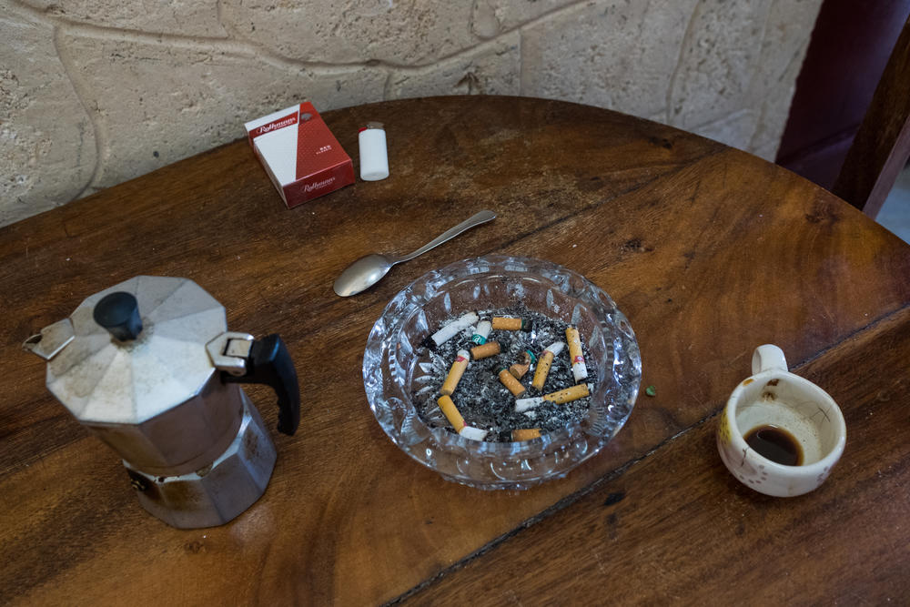 Leftover coffee and cigars smoked by Lauren at her home in Havana. The couple had quit smoking before Jan left Cuba. During Jan's journey, Lauren suffered from many anxiety attacks and returned to smoking.