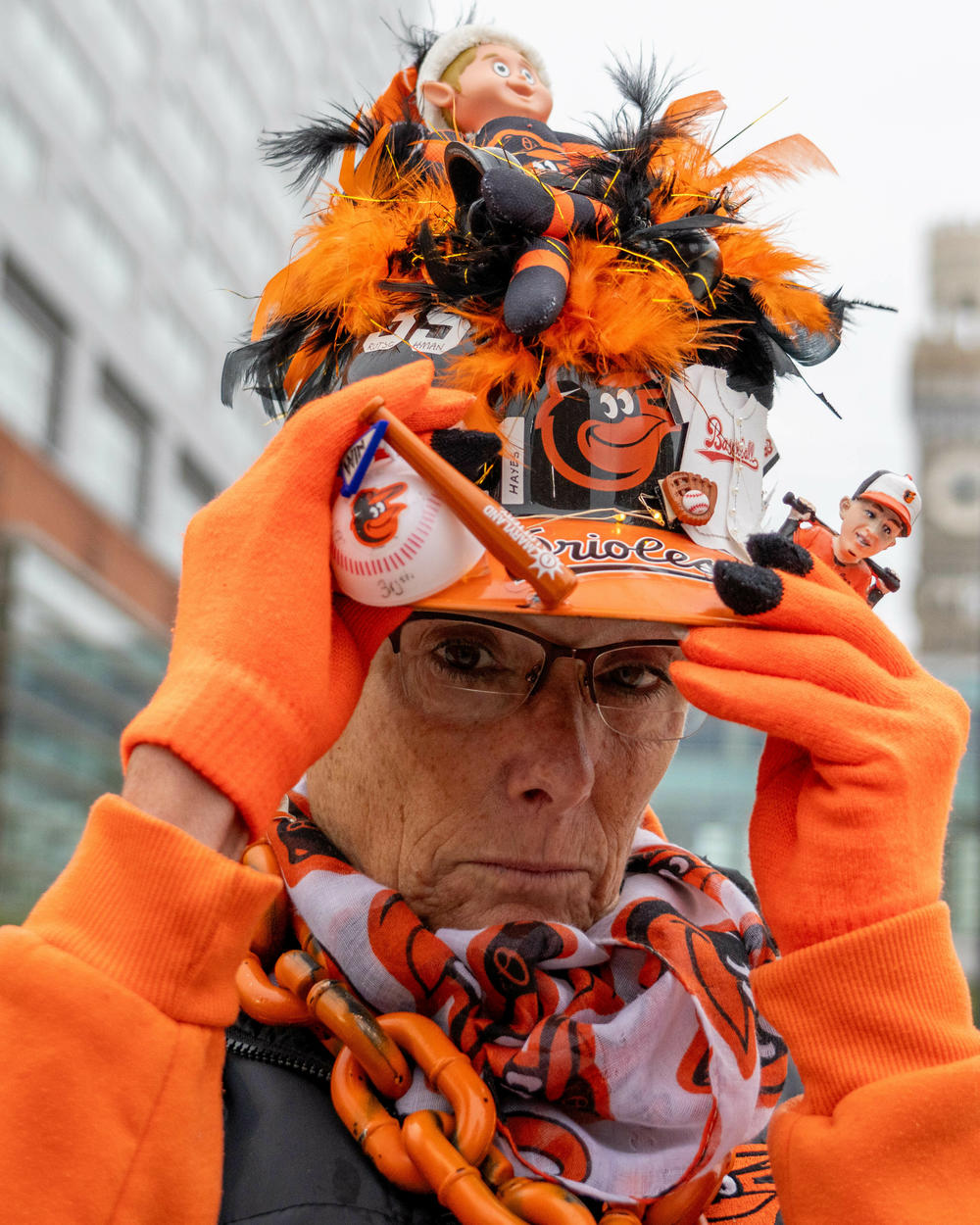 Robin Goodwin shows off her Orioles hat ahead of the game.