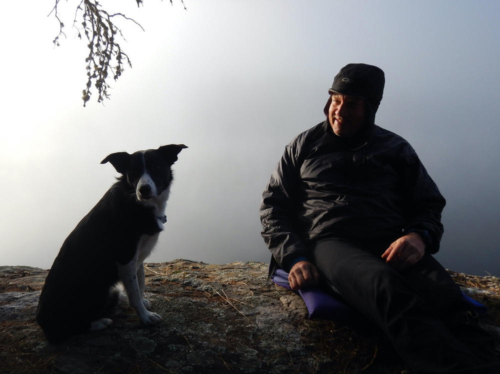 Doug Inglis sits with his dog, Tris, in a 2018 trek in Quetico Provincial Park.