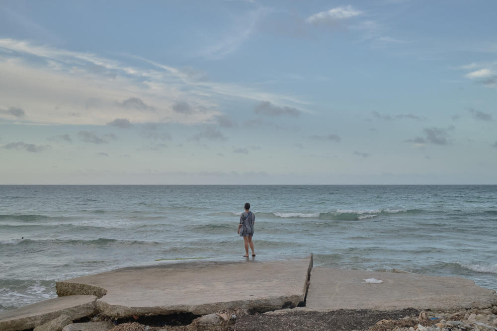 Lauren looks out at the sea in Havana.