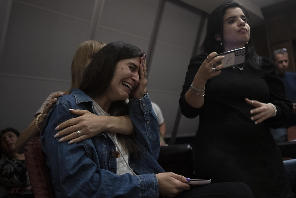 Sun., Oct. 8: A relative of an Israeli missing since a surprise attack by Hamas militants near the Gaza border, is overcome by emotion during a press conference in Ramat Gan, Israel.