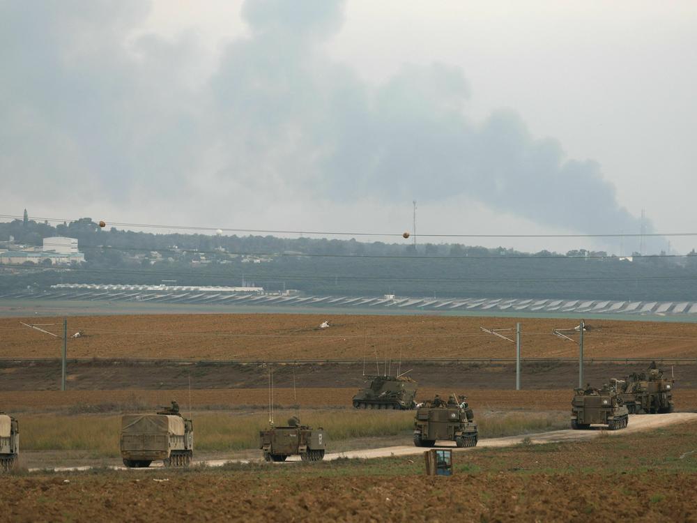 Israeli troop reinforcements take position at the border with Gaza in southern Israel on Monday. Social media and messaging apps have been flooded with false and out of context images since fighting started this weekend.