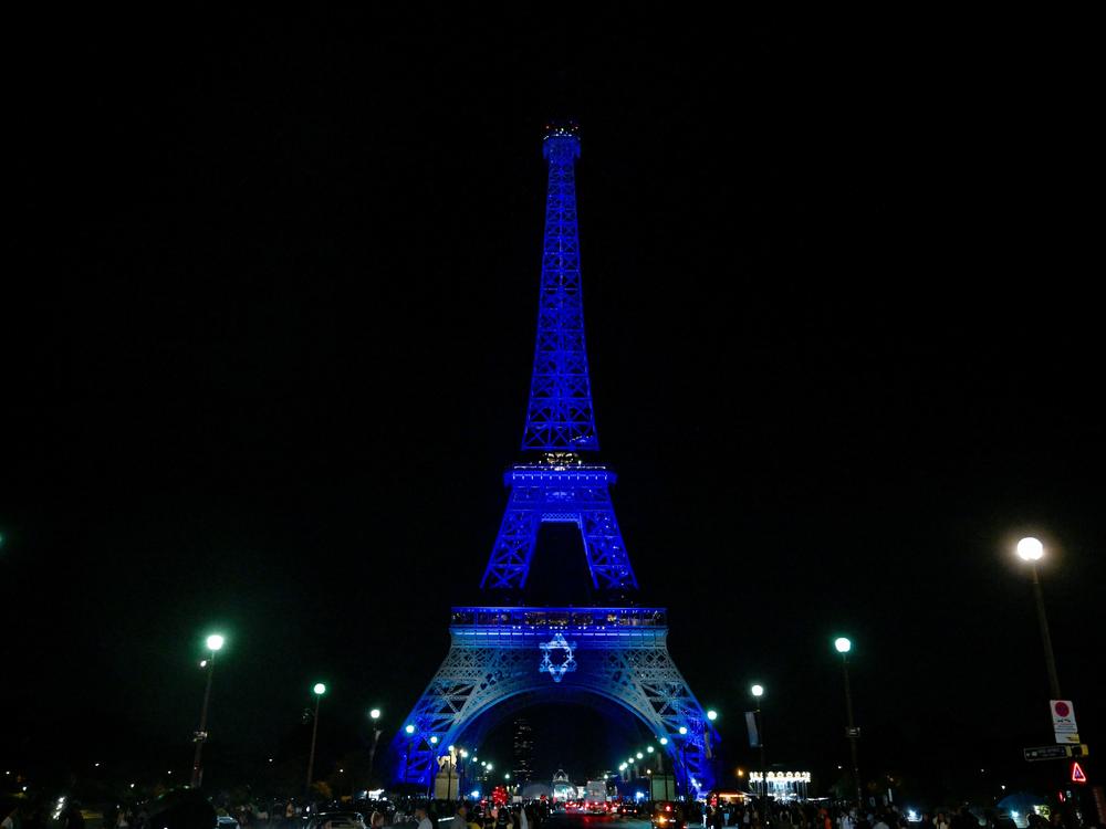 The Eiffel Tower in Paris is illuminated on Oct. 9 with the Star of David and the colors of the national flag of Israel, in tribute to the victims of the recent Hamas attacks.