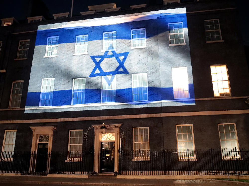 Israel's flag is projected onto the front of 10 Downing Street in a show of support on Sunday in London.