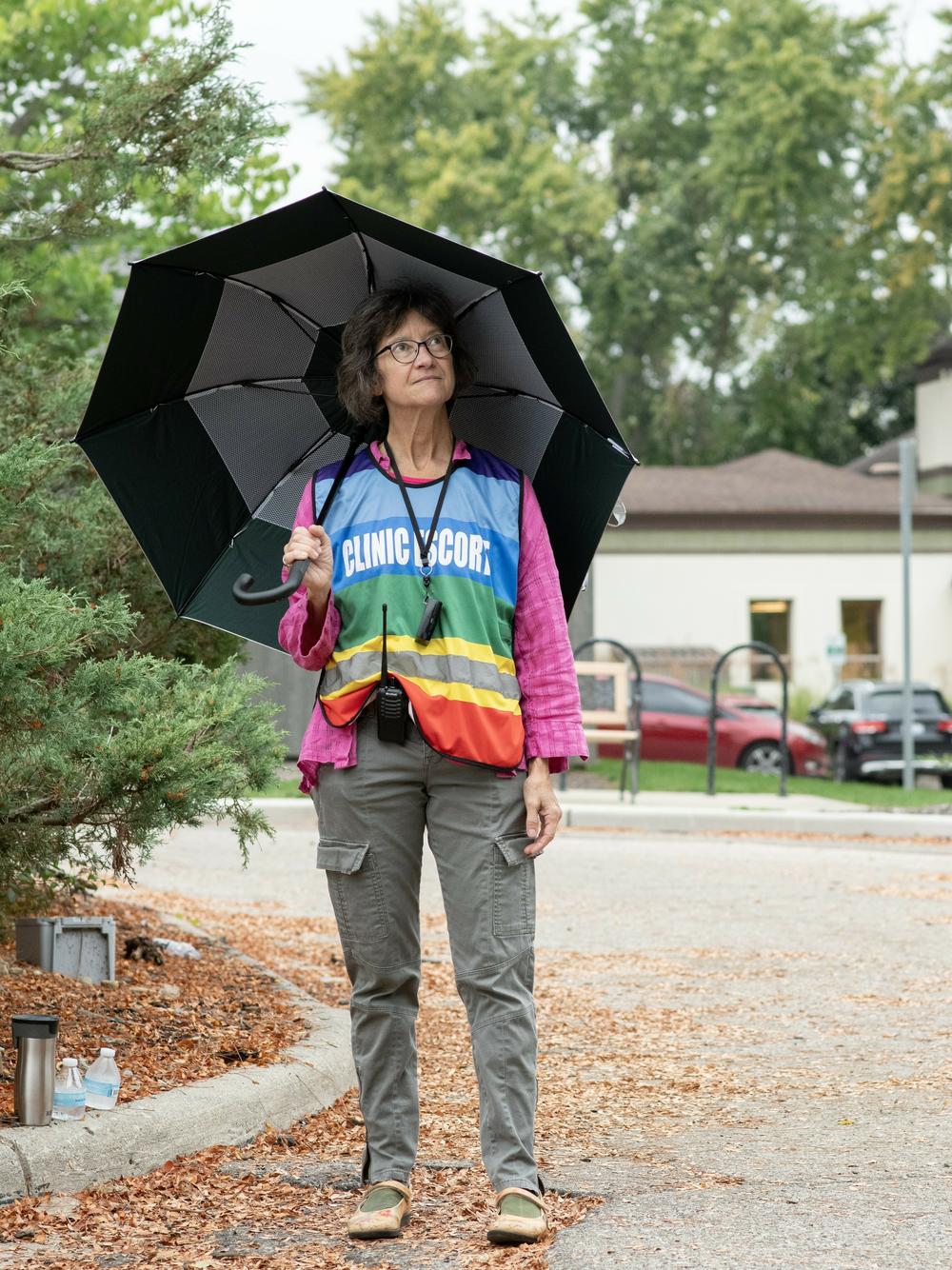 Michelle O'Grady is a patient escort at the Planned Parenthood clinic in Ann Arbor, Michigan. She uses her umbrella to shield patients from the view of any protestors as they walk into the clinic.