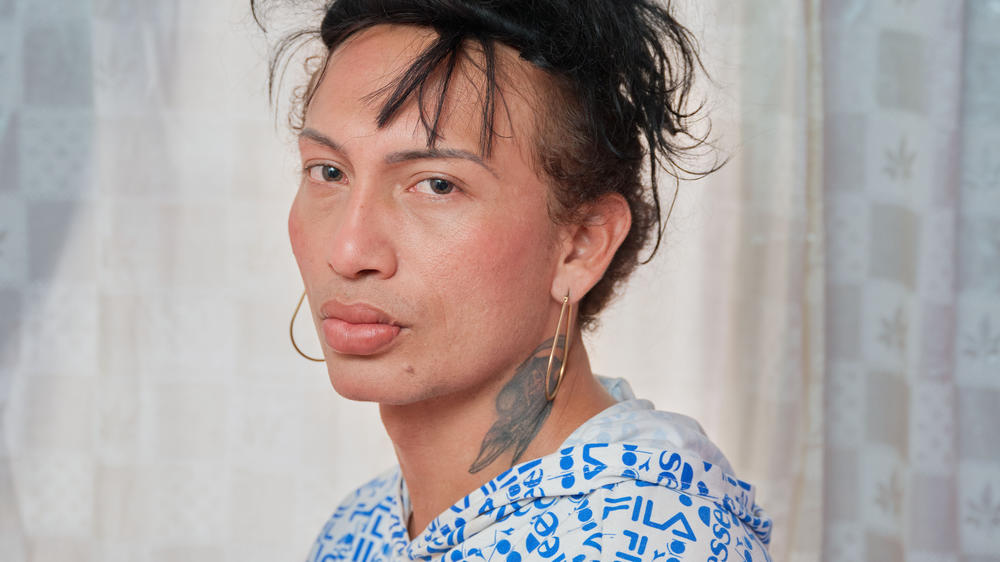 Charloth Chirino poses for a portrait in her apartment in Medellín. Originally from Maracaibo, Venezuela, Charloth has been living in Colombia for seven years, three of those in Medellín. She has lived her life as a proud trans woman since she was 15 years old, when she also began working as a sex worker.