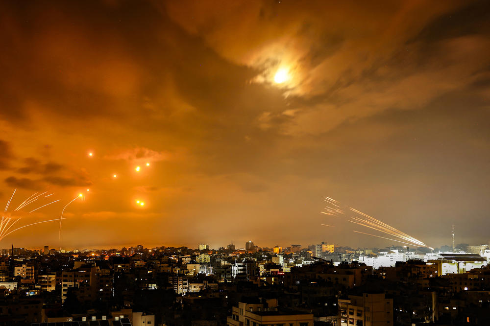 Rockets fired by Palestinian militants from Gaza are intercepted by the Israeli Iron Dome defense missile system in the early hours of Sunday.