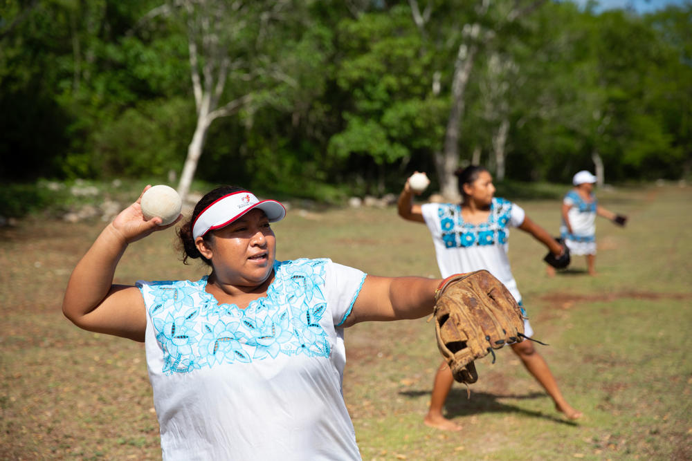 Yessica Yasmin Diaz Canul, 30 (left), a player of the Amazonas of Yaxunah team, practices at the community field.