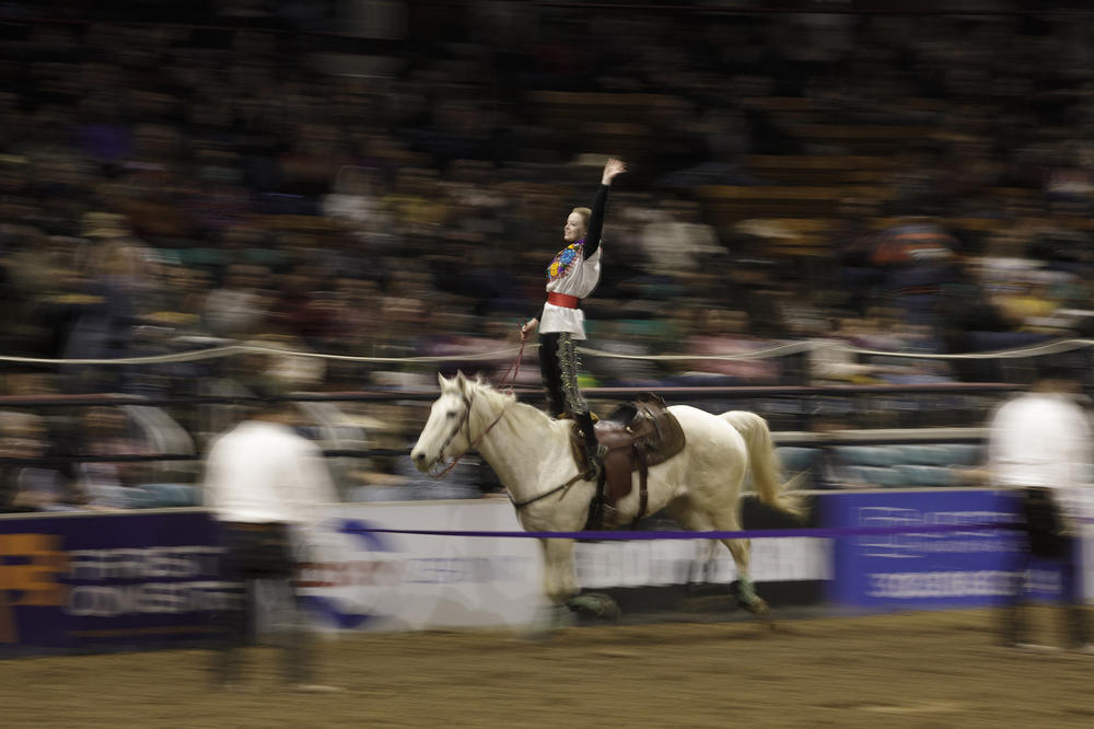 A member of the Westernaires performs tricks during the Mexican Rodeo Extravaganza in Denver, Colo.