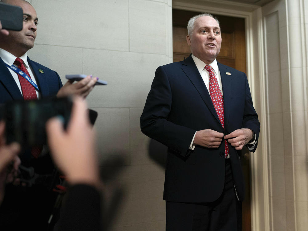 House Majority Leader Steve Scalise, R-La., talks to reporters as he leaves Republicans' closed-door forum in which they heard from the candidates for House speaker on Tuesday.