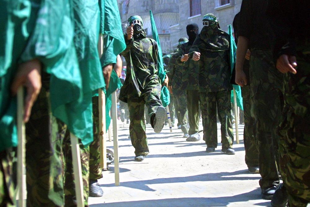 Masked members of Hamas hold Islamic flags during a 2002 march in the Jabalia refugee camp in the Gaza Strip to protest against the U.S. position on Jerusalem.