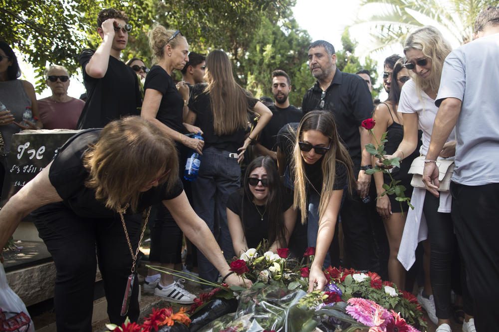 Family and friends of May Naim, 24, who was murdered by Palestinians militants at the 